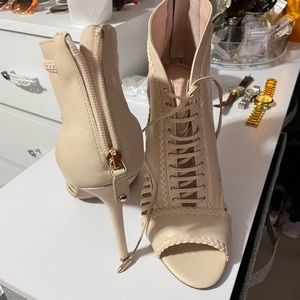 A story told by Joyce Azria Lace-up Cage Stiletto size 11